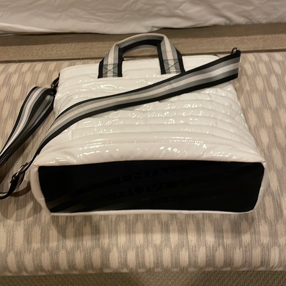 Think Royln messenger bag. White puffy wipe clean material. 3 interior pockets